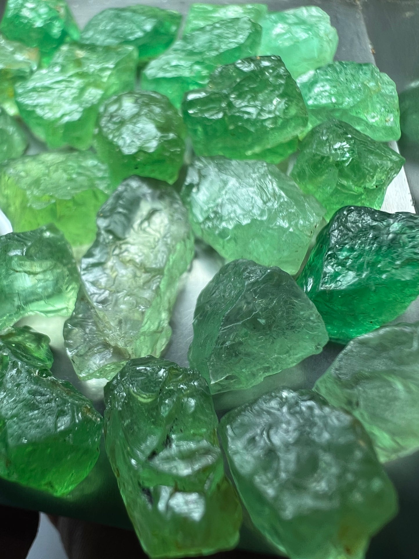 Emerald green kornerupines 168.35 cts / 24 pcs