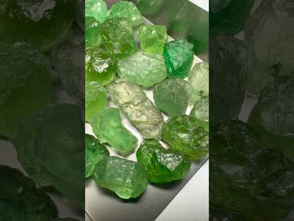 Emerald green kornerupines 168.35 cts / 24 pcs